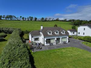 an aerial view of a house in a field at Greenside B&B in Westport