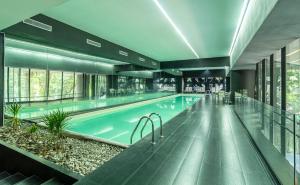 a large swimming pool in a building at Casa Magenta by Kukun in Mexico City