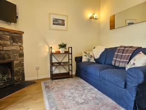 Predel za sedenje v nastanitvi Cosy peaceful one-bedroom cottage in Pitlochry