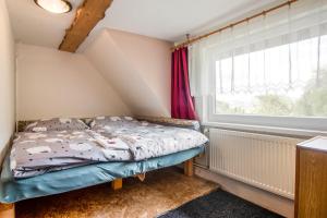 Ein Bett oder Betten in einem Zimmer der Unterkunft Chalupa Kukajda