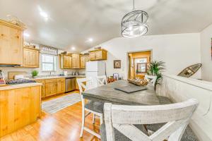 a kitchen and dining room with a table and chairs at Ruidoso Cabin Rental with Hot Tub Near Midtown! in Ruidoso +24 photos