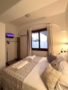 Postel nebo postele na pokoji v ubytování B&B Raggi d'Ischia