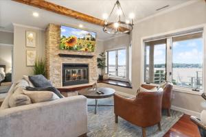a living room with a couch and a fireplace at Emerald Bay Unit 1B in Lake Ozark