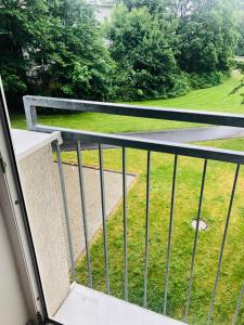 a balcony with a view of a park at Zentrale 1 1/2 Zimmer Apartment in Wolfsburg