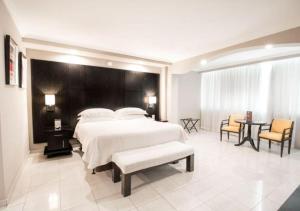 Säng eller sängar i ett rum på Hotel El Panama by Faranda Grand, a member of Radisson Individuals