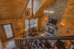 an overhead view of a living room with a fireplace at Black Bear Cabin by Stony Brook Cabins in Gatlinburg +34 photos