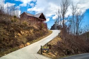 a road leading to a house on a hill at Black Bear Cabin by Stony Brook Cabins in Gatlinburg