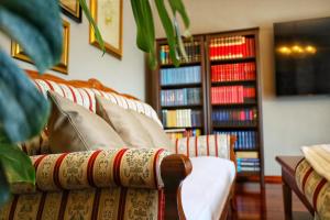 a living room with a couch and bookshelves at Villa F in Vrgorac - Makarska in Vrgorac