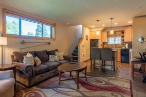 a living room with a couch and a table at Alpine Villa Condo 1 in Ketchum