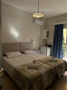 A bed or beds in a room at Venus Rooms