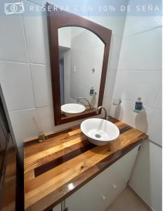 a bathroom with a sink and a mirror at Residencia Céntrica in Chilecito