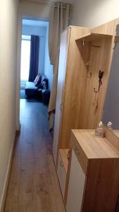 a room with a kitchen and a living room at Hyper centre Strasbourg in Strasbourg