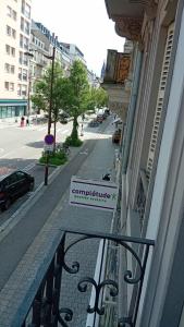 a balcony of a building with a sign on it at Hyper centre Strasbourg in Strasbourg
