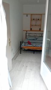 a bedroom with a bed in the corner of a room at Hyper centre Strasbourg in Strasbourg