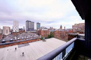 a view of a city skyline from a building at Pluxa Citronella -2 floors Home of football location with Workspace in Manchester