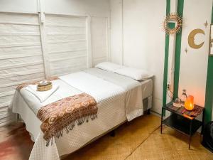 a small bedroom with a bed in a room at Unicorn Reborn - Peaceful Rentals in San Marcos La Laguna
