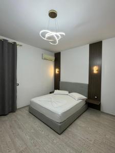 Postel nebo postele na pokoji v ubytování Hotel Kaloshi