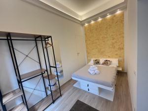 a bedroom with a bunk bed and a ladder at Monolocale Pura Vida in Viareggio