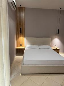 Postel nebo postele na pokoji v ubytování Hotel Kaloshi
