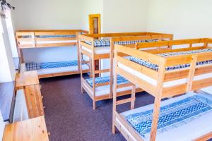 a room with three bunk beds in a room at Domček Horskej Služby in Liptovská Sielnica +21 photos