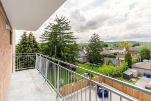 a balcony with a view of a town at 2BR Apt - Near Downtown Hamilton - Sleeps 6 in Hamilton