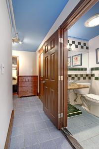 a bathroom with a toilet and a sink at Chelsea Pines Inn in New York