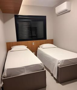 מיטה או מיטות בחדר ב-Lar no Bueno