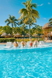 a group of people in the swimming pool at a resort at Grand Palladium Colonial Resort & Spa - All Inclusive in Akumal