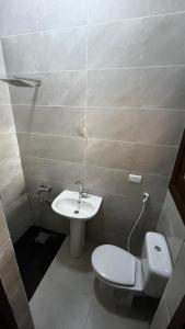 a bathroom with a toilet and a sink at Chalet in Marina 6 District 31 in El Alamein +31 photos