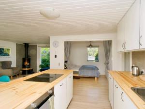 a kitchen and living room with a bed in the background at 6 person holiday home in Skibby-By Traum in Skibby