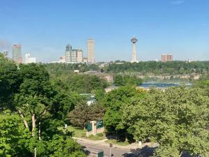 a view of a city skyline with a river and trees at Holiday Inn Niagara Falls-Scenic Downtown, an IHG Hotel in Niagara Falls