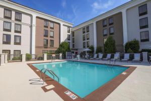 a large swimming pool in front of a building at Holiday Inn Express Burlington by IHG in Burlington