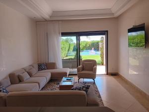 Posezení v ubytování Villa orangeraie + 21 fotografií