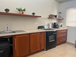 Kjøkken eller kjøkkenkrok på Casa Llena de Vida LB8 Alberca privada VISTA A LA BAHIA