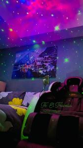 a room with a bed with a purple ceiling at Azure Urban Residences in Manila
