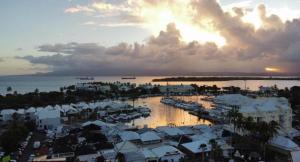 a view of a harbor with boats in the water at Duplex piscine vue imprenable Marina du Gosier avec citerne in Le Gosier