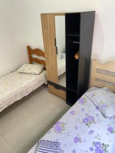 Ένα ή περισσότερα κρεβάτια σε δωμάτιο στο Aconchego! Sua casa com Piscina em Passos!!