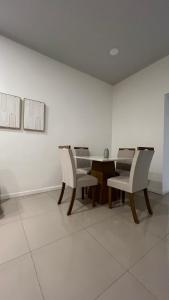 a dining room with a table and two chairs at Relax X in Paysandú +5 photos