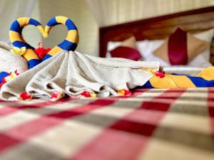a group of stuffed animals laying on a bed at D mas huts lembongan in Nusa Lembongan