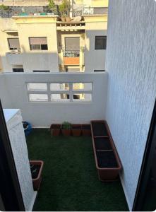 Balkón nebo terasa v ubytování Chambre à Agdal Rabat dans un appartement partagé -king bed-