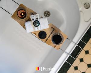 a table with two cups of coffee and towels at The Moorings in Iluka +27 photos