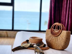 a basket and a straw bag on a table at Happy Light Hotel Nha Trang in Nha Trang