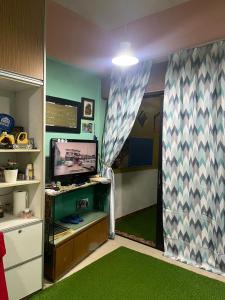 Μια τηλεόραση ή/και κέντρο ψυχαγωγίας στο RMS Homestay +13 φωτογραφίες