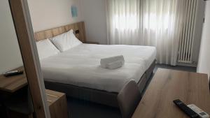 Postel nebo postele na pokoji v ubytování Hotel Doria - Business & Bike + 15 fotografií