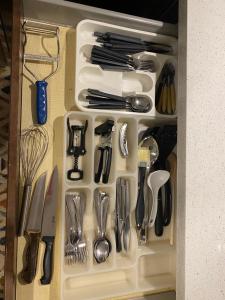 a drawer filled with lots of utensils at Beautiful Lower level 2 bedroom aprt in Toronto