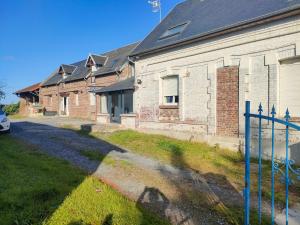 an old brick building with a fence in front of it at chambre simple Viry Noureuil in Viry-Noureuil
