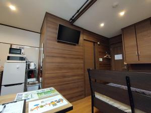a small kitchen with a table and a refrigerator at Kyoto - apartment / Vacation STAY 168 in Kyoto