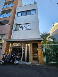 a motorcycle parked in front of a building at Kyoto - apartment / Vacation STAY 168 in Kyoto