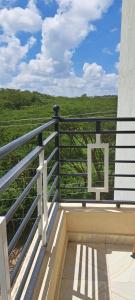 a balcony with a view of a green field at Swanky Stays I in Nairobi