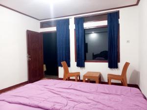 Postel nebo postele na pokoji v ubytování Ruteng Glamping & Campsite